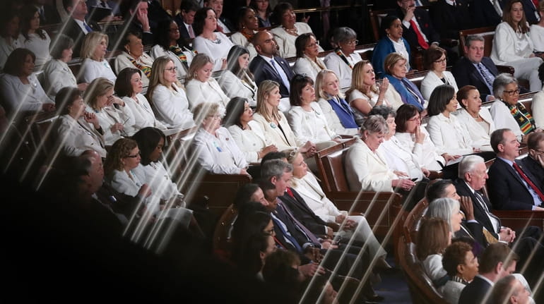 A group of Democratic Congresswomen wearing white to celebrate the...