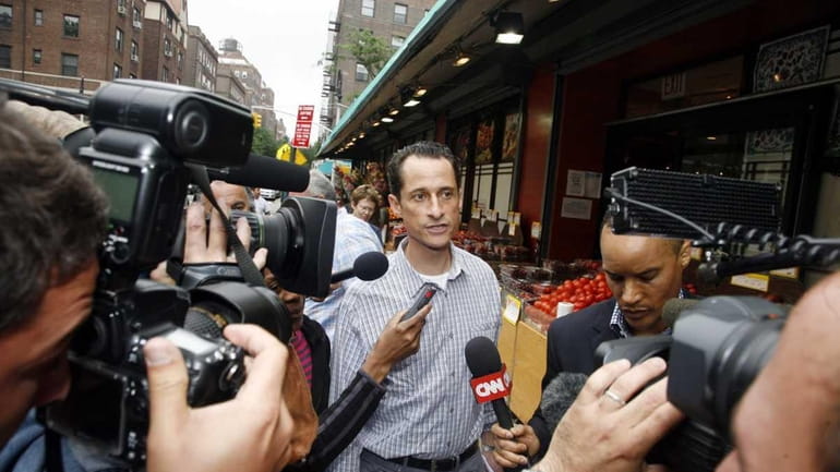 Rep. Anthony Weiner is questioned by the media near his...