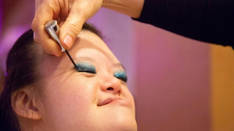 Samantha Dee gets her makeup done by a makeup artist...