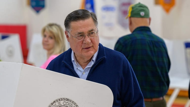 Ed Romaine arrives to cast his ballot at the Center...