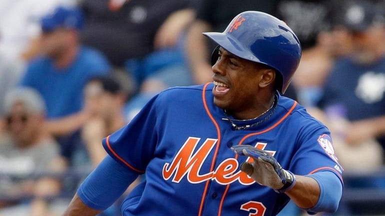 Curtis Granderson rounds first after hitting a single during the...