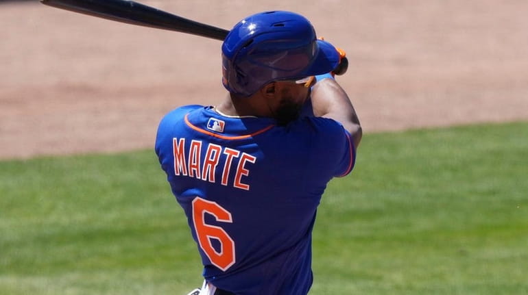 Starling Marte of the Mets hits a double in the...