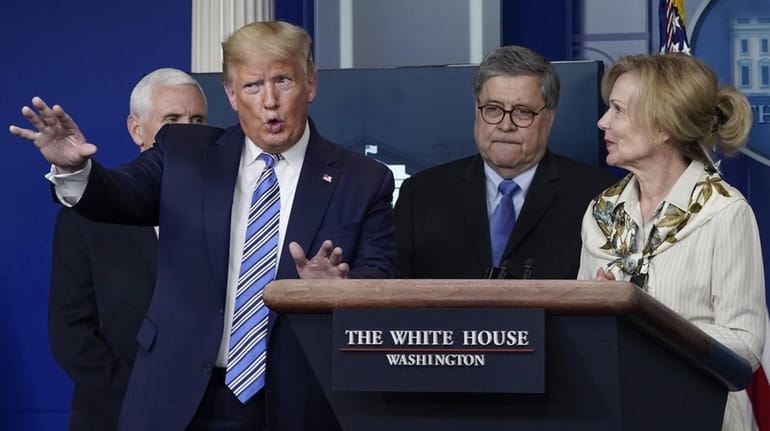 President Donald Trump on Monday with Attorney General William Barr...