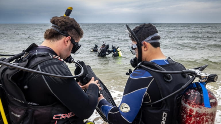 Students prepare for an open water dive at Prybil Beach...