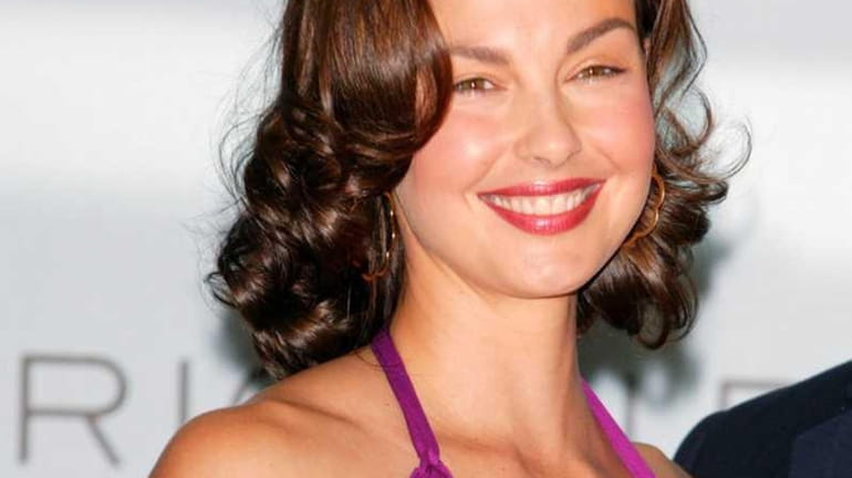 Actress Ashley Judd poses at press conference to announce her...