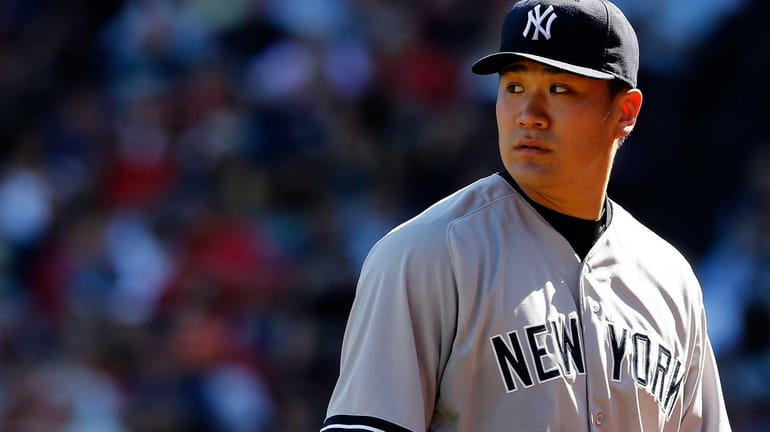 Masahiro Tanaka of the Yankees looks on against the Boston...