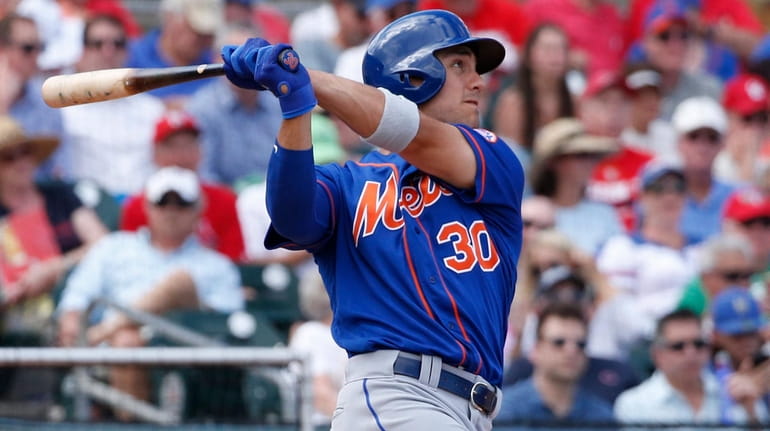 Michael Conforto #30 of the Mets hits the ball against...