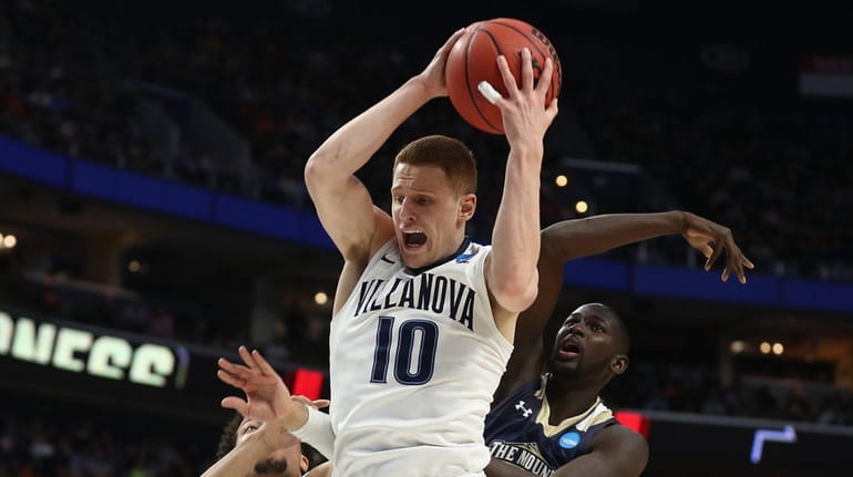 Donte DiVincenzo #10 of the Villanova Wildcats rebounds against the...