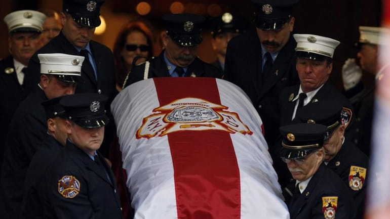 The casket of 9/11 responder and FDNY member John McNamara...