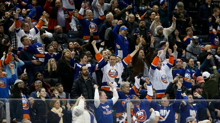 Fan cheer after the Islanders scored a third-period goal against...