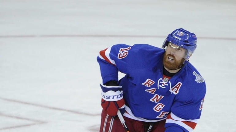 Rangers center Brad Richards looks up at the puck against...