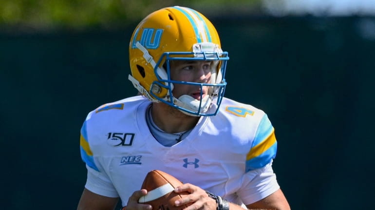Long Island Sharks quarterback Clay Beathard looks to pass in the...