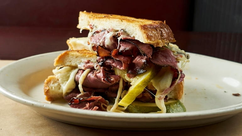 A pastrami grilled cheese with Swiss, mustard and pickles at...