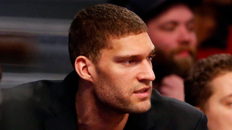 Brook Lopez #11 of the Brooklyn Nets looks on during...
