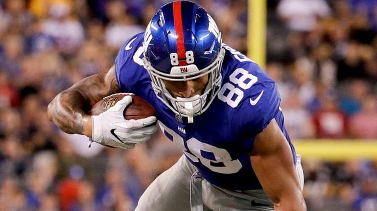 Giants tight end Evan Engram is tripped up by Pittsburgh...