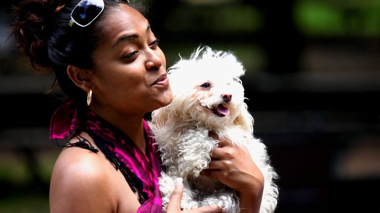 Liz Bissessar, of Franklin Square, holds her dog 'Princess" at...