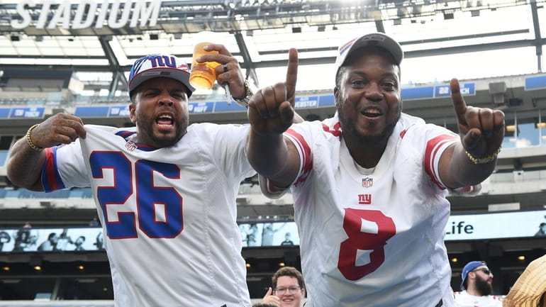 New York Giants fans cheer in the stands during Giants...