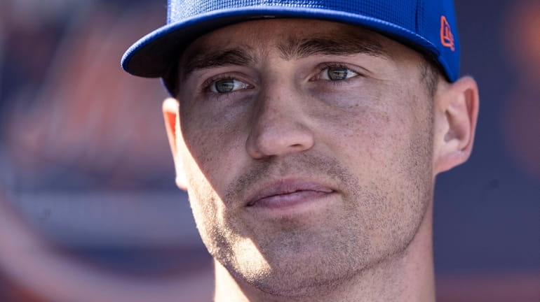 Mets outfielder Brandon Nimmo looks on before a spring training...