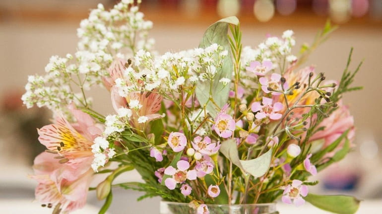 Baby's breath and wax flowers with a couple of lilies...
