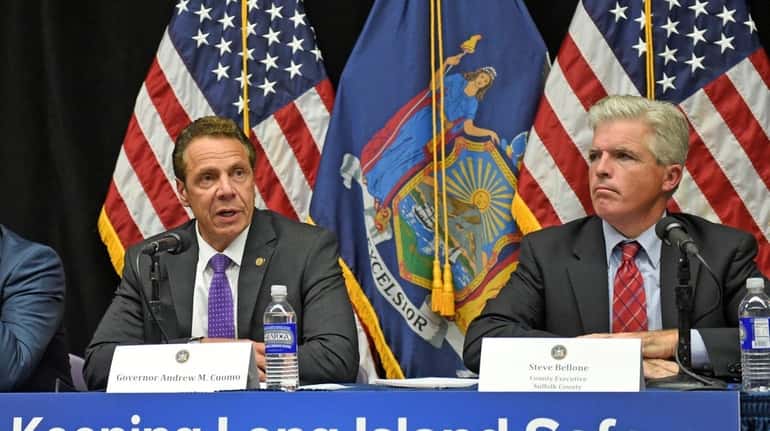Gov. Andrew M. Cuomo, left, with Suffolk County Executive Steve...