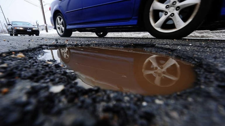 A pothole on New South Road in Hicksville (Feb. 2,...