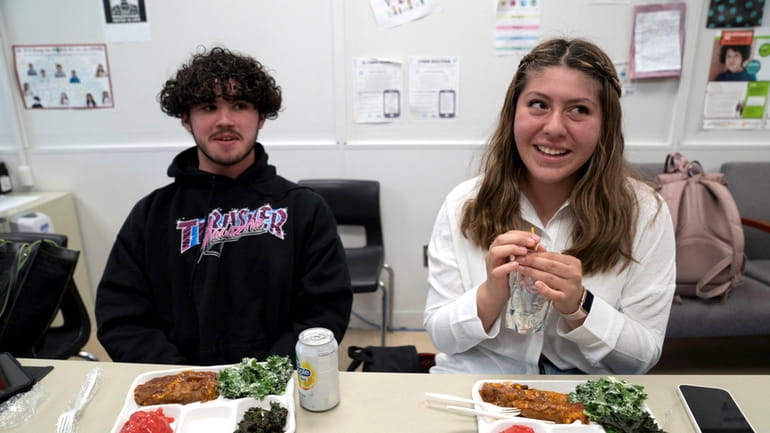 Dylan Borrelli, left, and Jessica Rojas, both juniors, have their...
