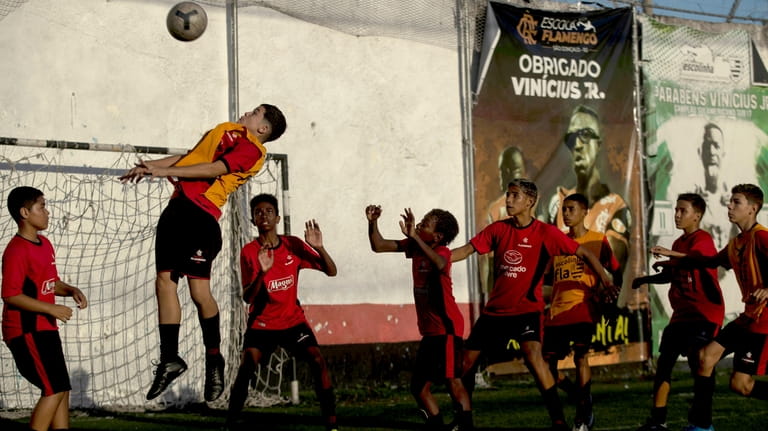 Boys play soccer at the Flamengo Sao Gonçalo school where...