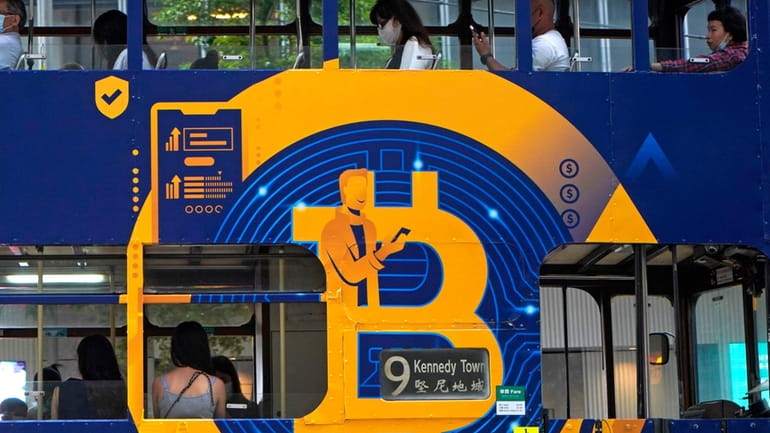 An advertisement for the cryptocurrency Bitcoin displayed on a tram,...