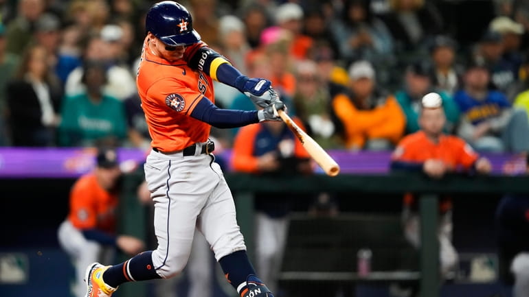 Houston Astros' Mauricio Dubon hits a three-run home run against...
