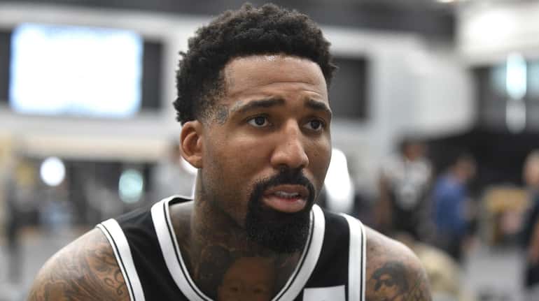 Wilson Chandler speaks with reporters during Nets media day on...