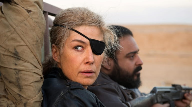 Actress Rosamund Pike plays Sunday Times war correspondent Marie Colvin in...
