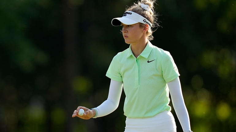 Nelly Korda acknowledges the crowd after her shot on the...