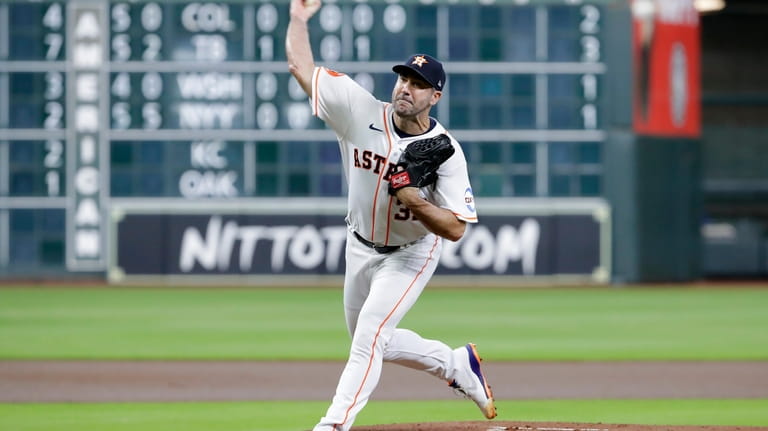 Houston Astros starting pitcher Justin Verlander throws against the Boston...