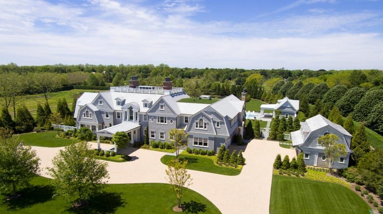 The 16,000 square-foot house has nine en-suite bedrooms and a...