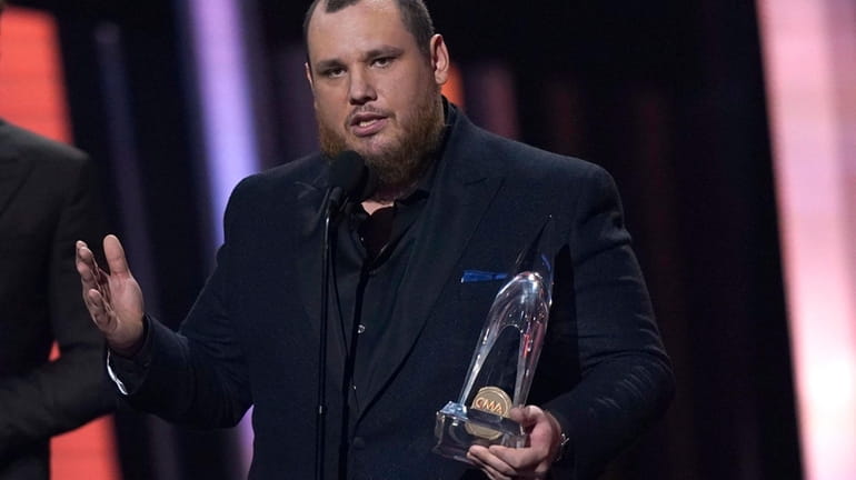 Luke Combs accepts the honor for entertainer of the year...