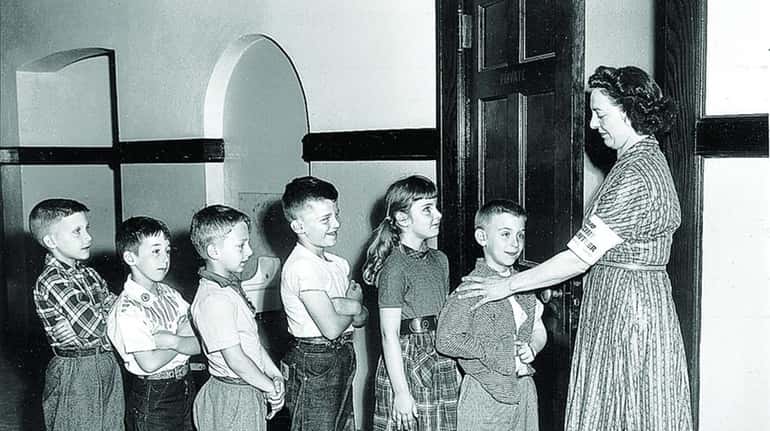 Children line up for polio vaccine shots at the Woodbury...