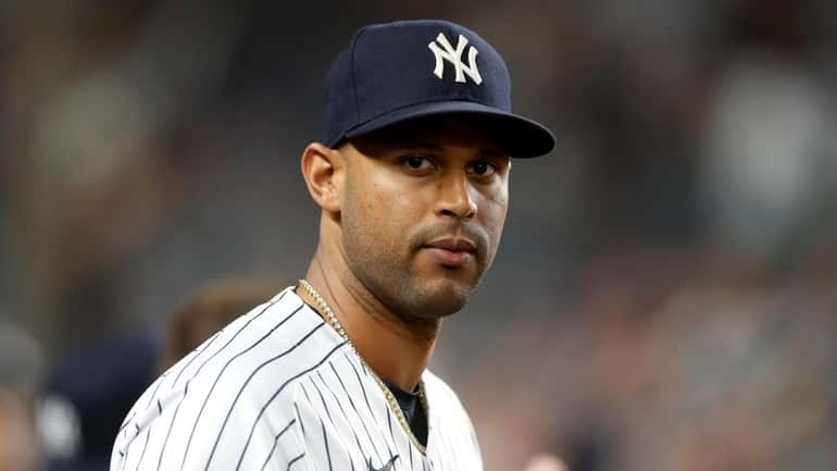 Aaron Hicks of the Yankees looks on during the seventh inning...