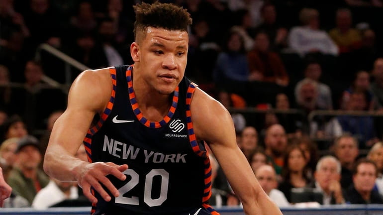 Kevin Knox of the Knicks controls the ball in the...