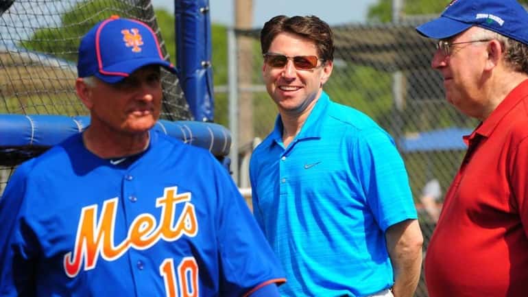 Mets COO Jeff Wilpon, center, at spring training at Port...