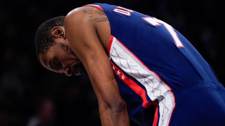 Nets forward Kevin Durant reacts during the second half of...