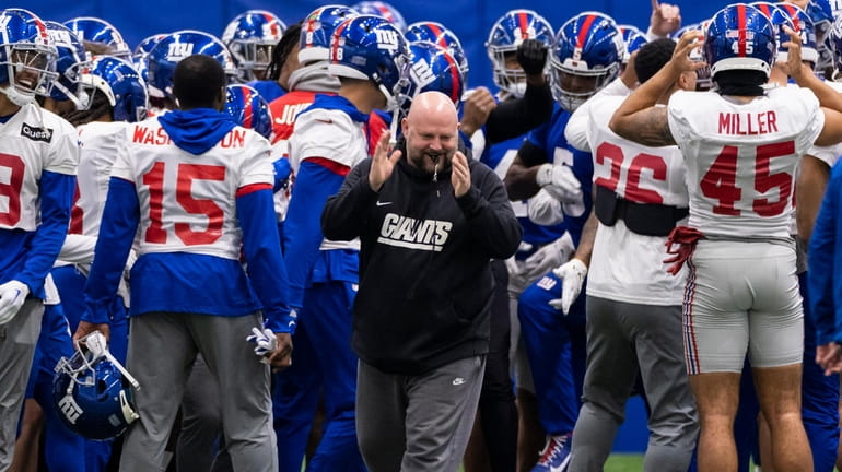 Giants head coach Brian Daboll reacts during practice at the...