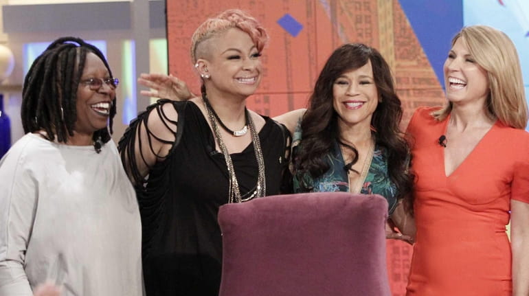From left, "The View" moderator Whoopi Goldberg, new -co-host Raven-Symone...