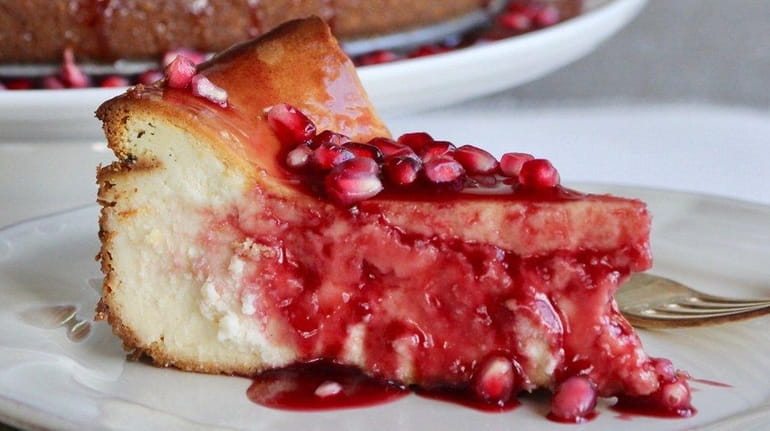 Cheesecake is topped with pomegranate sauce made from unsweetened juice...