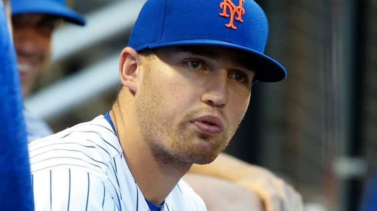 Brandon Nimmo of the Mets looks on from the dugout...