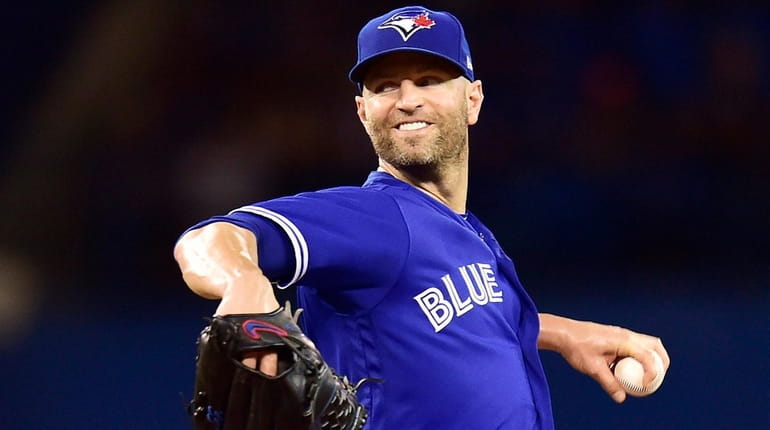 Blue Jays starting pitcher J.A. Happ works against the Orioles...