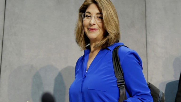 Naomi Klein arrives for a news conference at the Vatican...