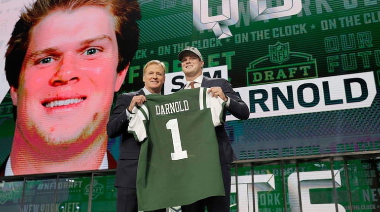 USC's Sam Darnold poses for photos with commissioner Roger Goodell...