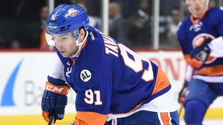 Islanders center John Tavares skates with the puck during the...