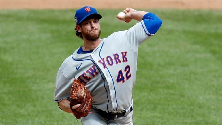 Steven Matz of the Mets pitches in relief against the Yankees...