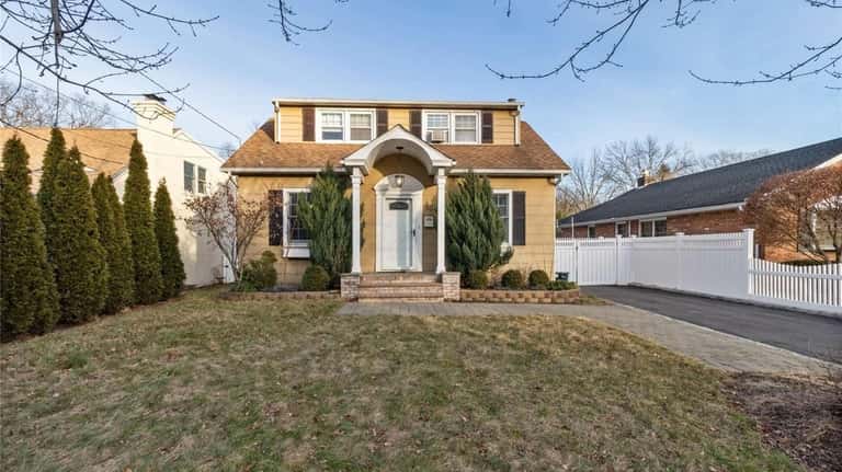 This three-bedroom, two-bath expanded Cape on Summers Street in Oyster...